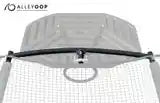 A white truss adapter fastened on a trampoline enclosure. Accessories like the basketball hoop and its adapter can improve motor skills, boost your balance, and encourage healthy competition for kids of all ages. 