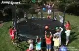 Kids playing a party game with the AlleyOOP party package. Our trampoline ball and game pack has over 20 creative trampoline games for multiple players. Kids can develop stamina, agility and more with trampoline games!