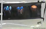 A shoe bag holding sneakers on an AlleyOOP trampoline. Great for storing shoes and items with heavy duty straps.