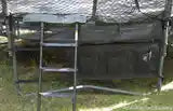 A shoe bag on the outside of an AlleyOOP trampoline. Great for storing shoes and items with heavy duty straps.